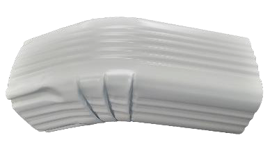 A close up of the corner of a white pipe